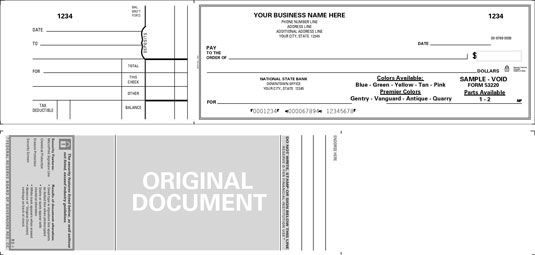 Un cheque bono de negocios es utilizado por muchas empresas que escriben manualmente sus cheques. [Crédito: